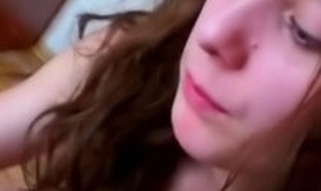 Curly babe with gorgeous face and full sweet lips begins undressing in advance of camera