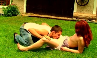Filthy redhead bitch is fucking with her partner on the grass